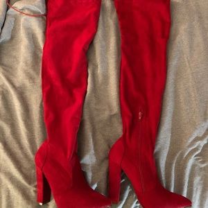 Red thigh high heel boot